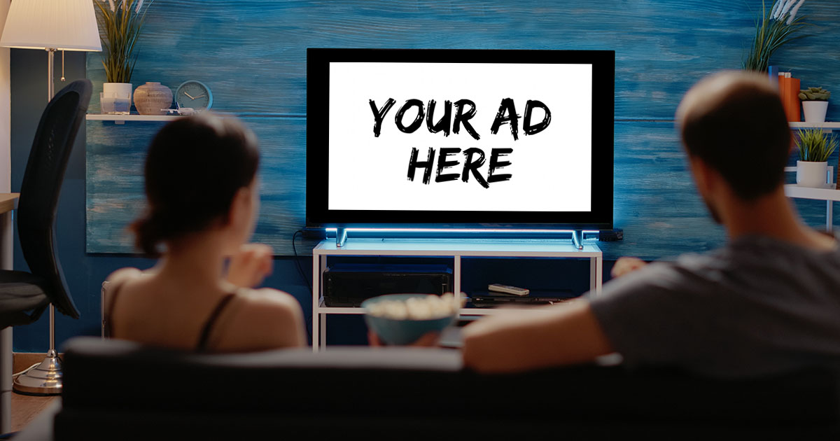 Couple watching ad supported streaming TV in their living room.